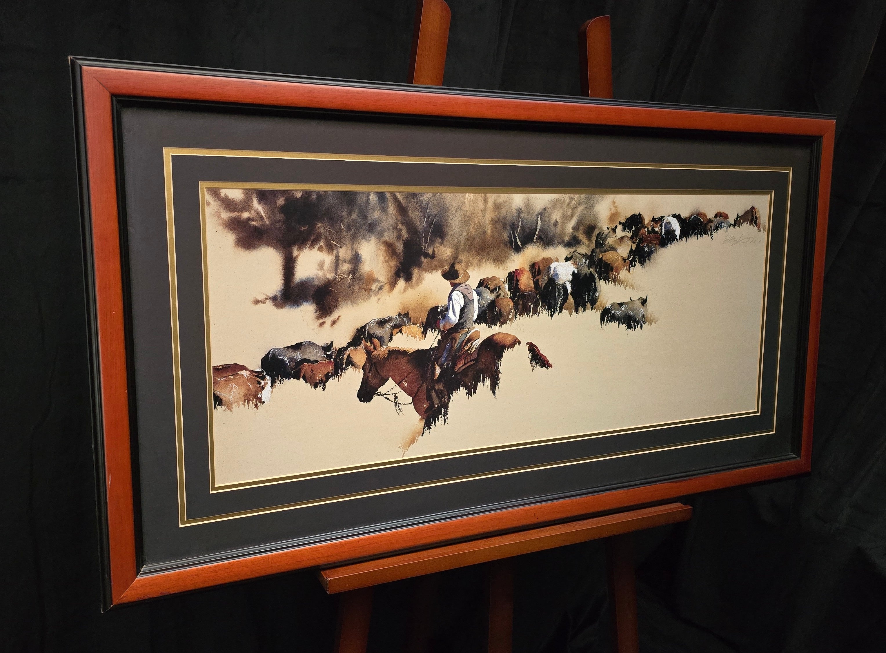 Cowboy on Horseback Herding Cattle