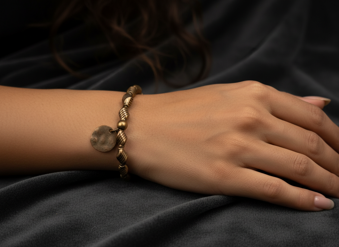 Bronze Colored Beaded Bracelet Featuring a Single Circle Charm