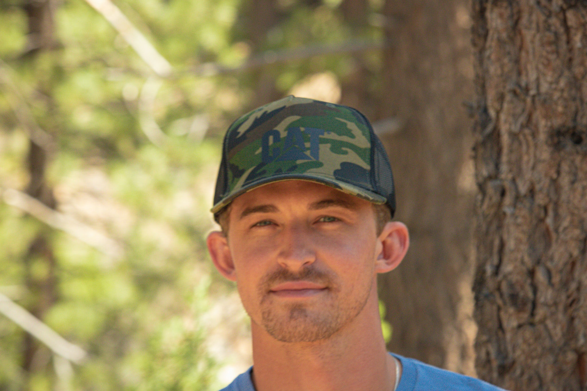 Trucker Cap with Cat Logo Color: Woodland Camo