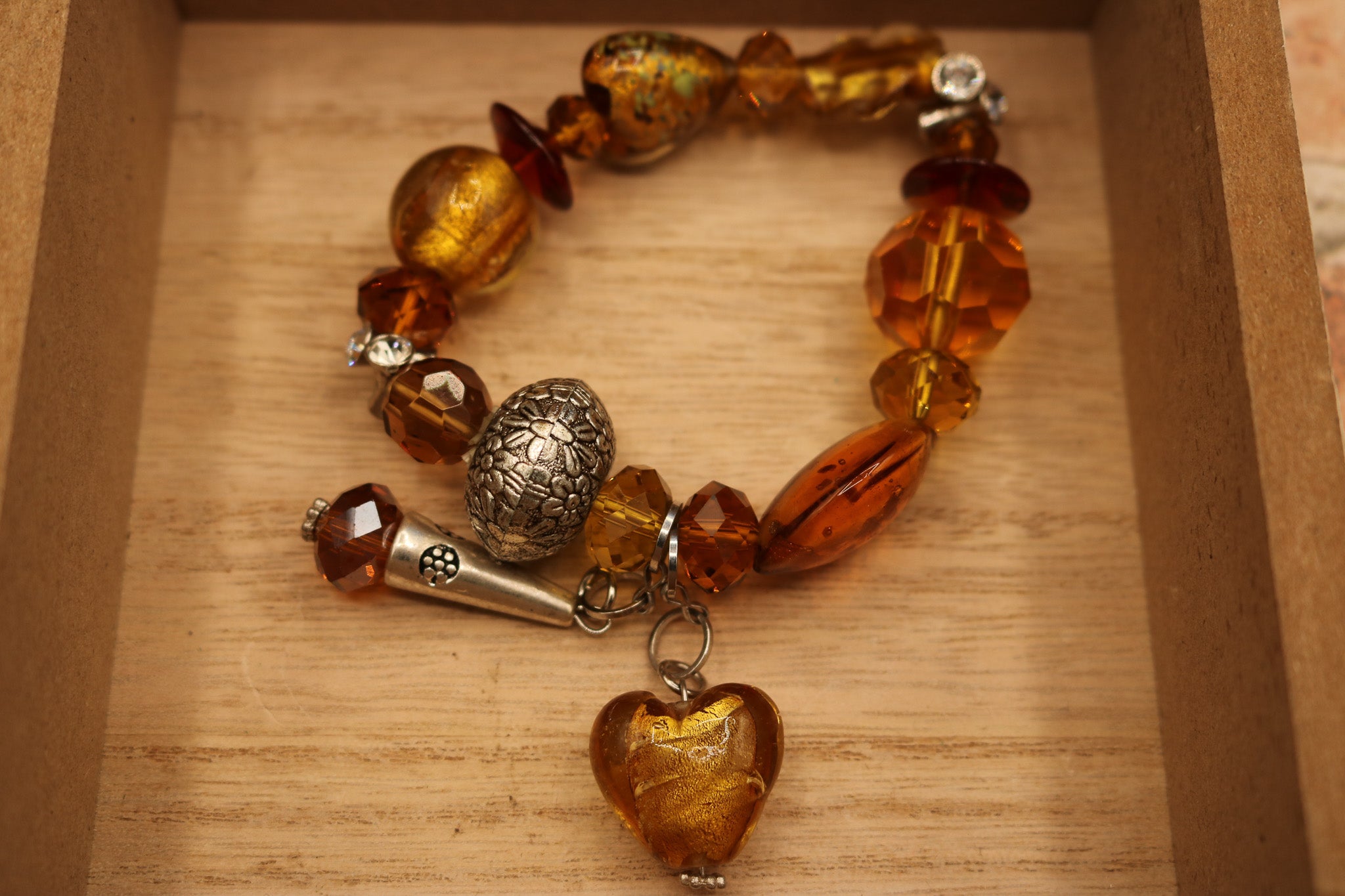 Chunky Stretchy Amber Colored Plastic Beads with Heart Shaped Charm