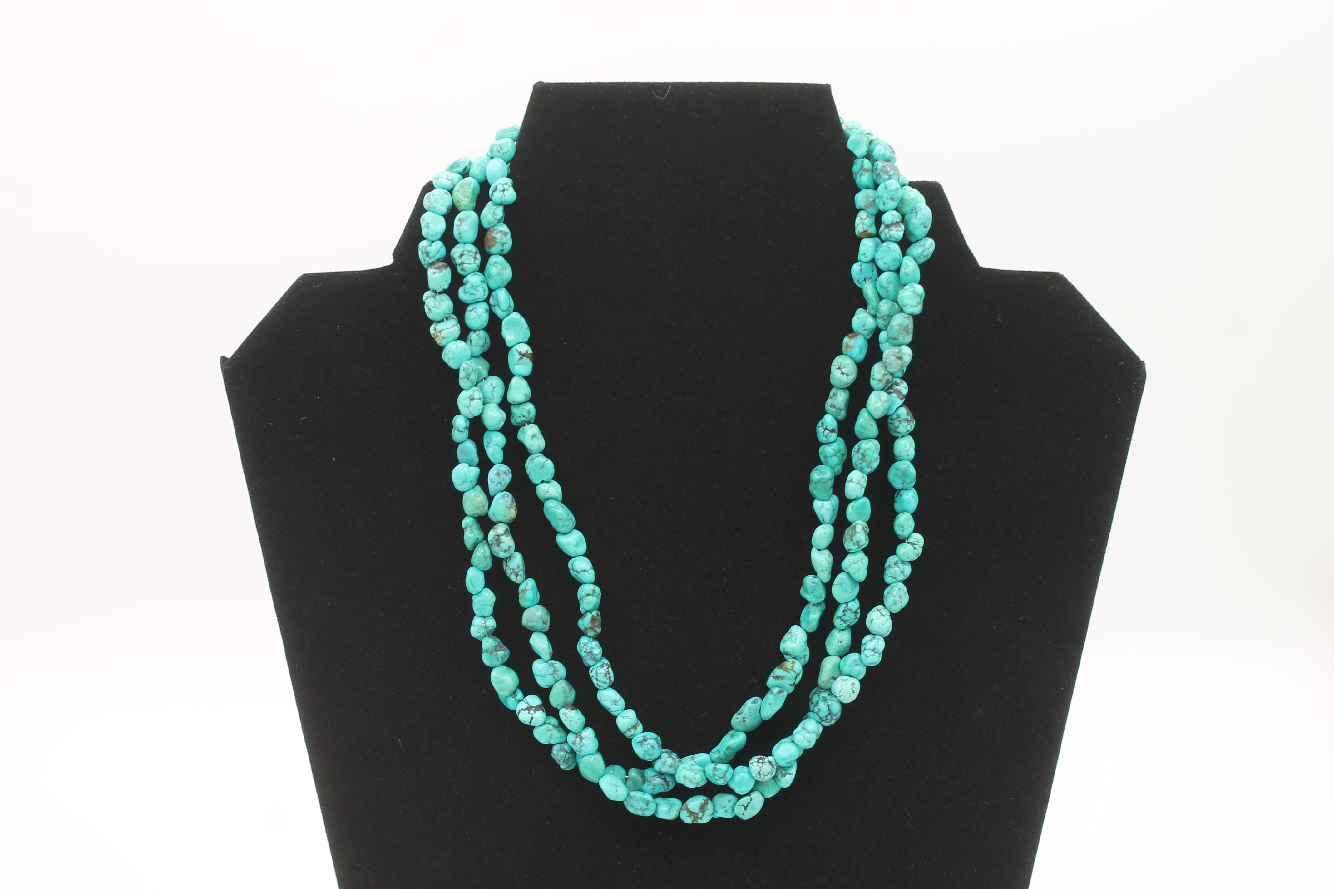 Vintage Navajo Turquoise Nugget Triple Strand Necklace with a Sterling Silver Toggle Clasp.