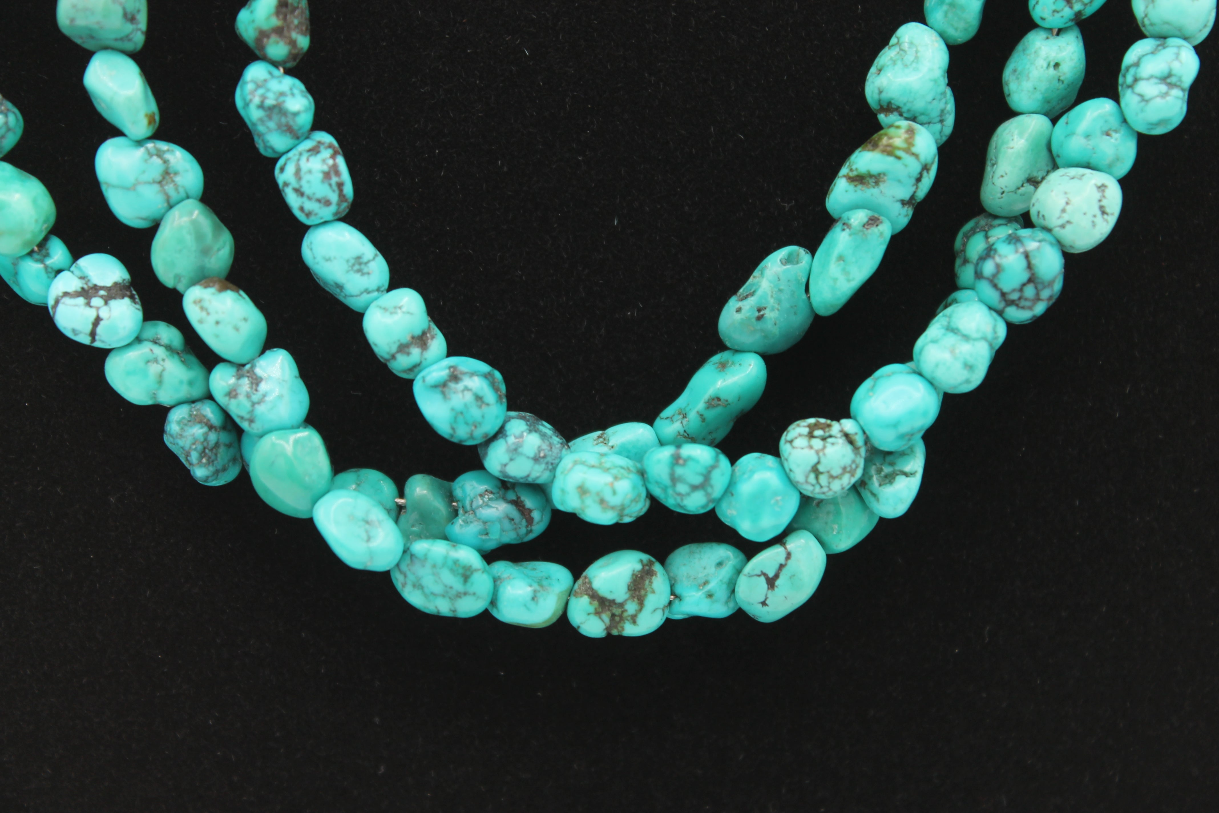 Vintage Navajo Turquoise Nugget Triple Strand Necklace with a Sterling Silver Toggle Clasp.