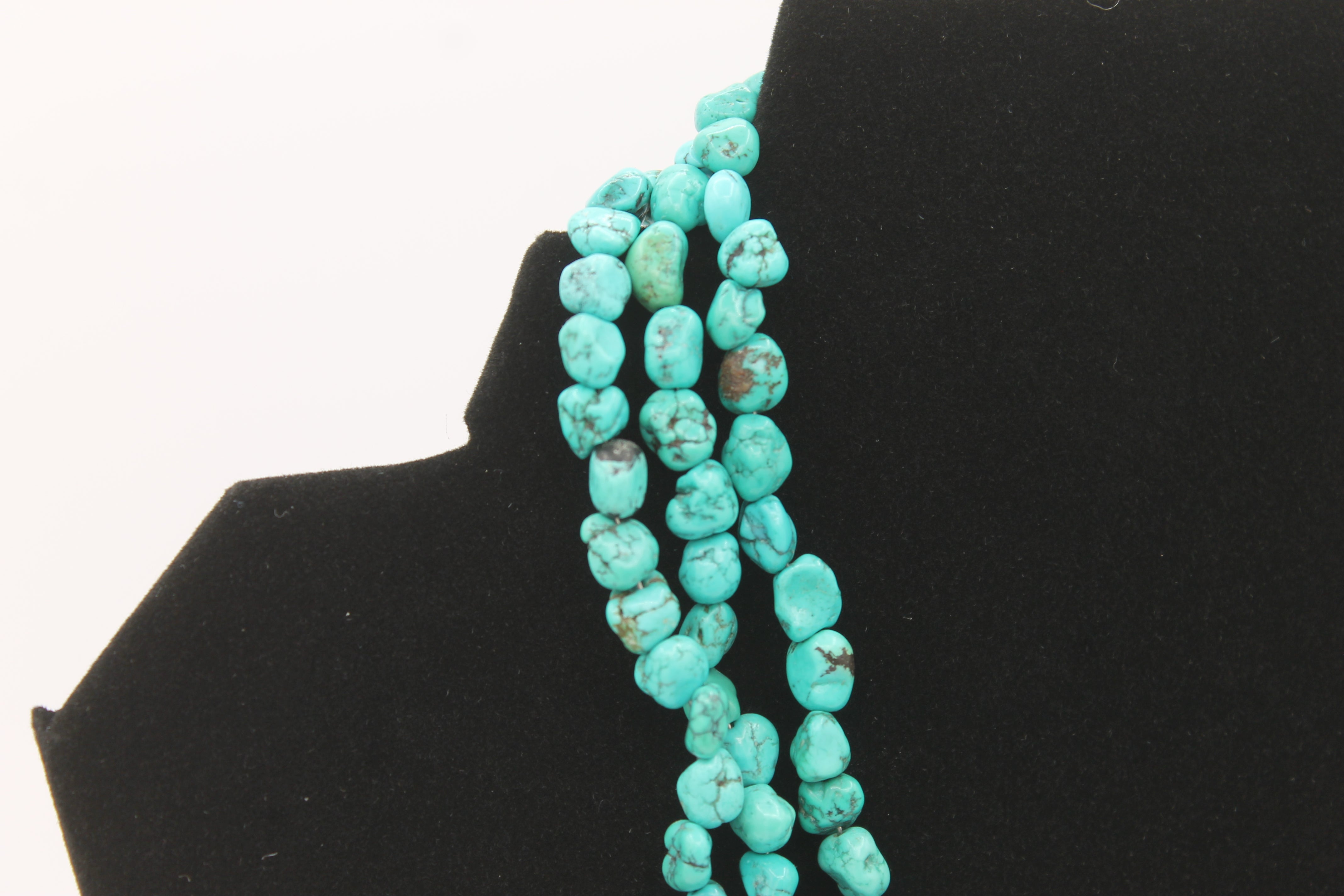 Vintage Navajo Turquoise Nugget Triple Strand Necklace with a Sterling Silver Toggle Clasp.