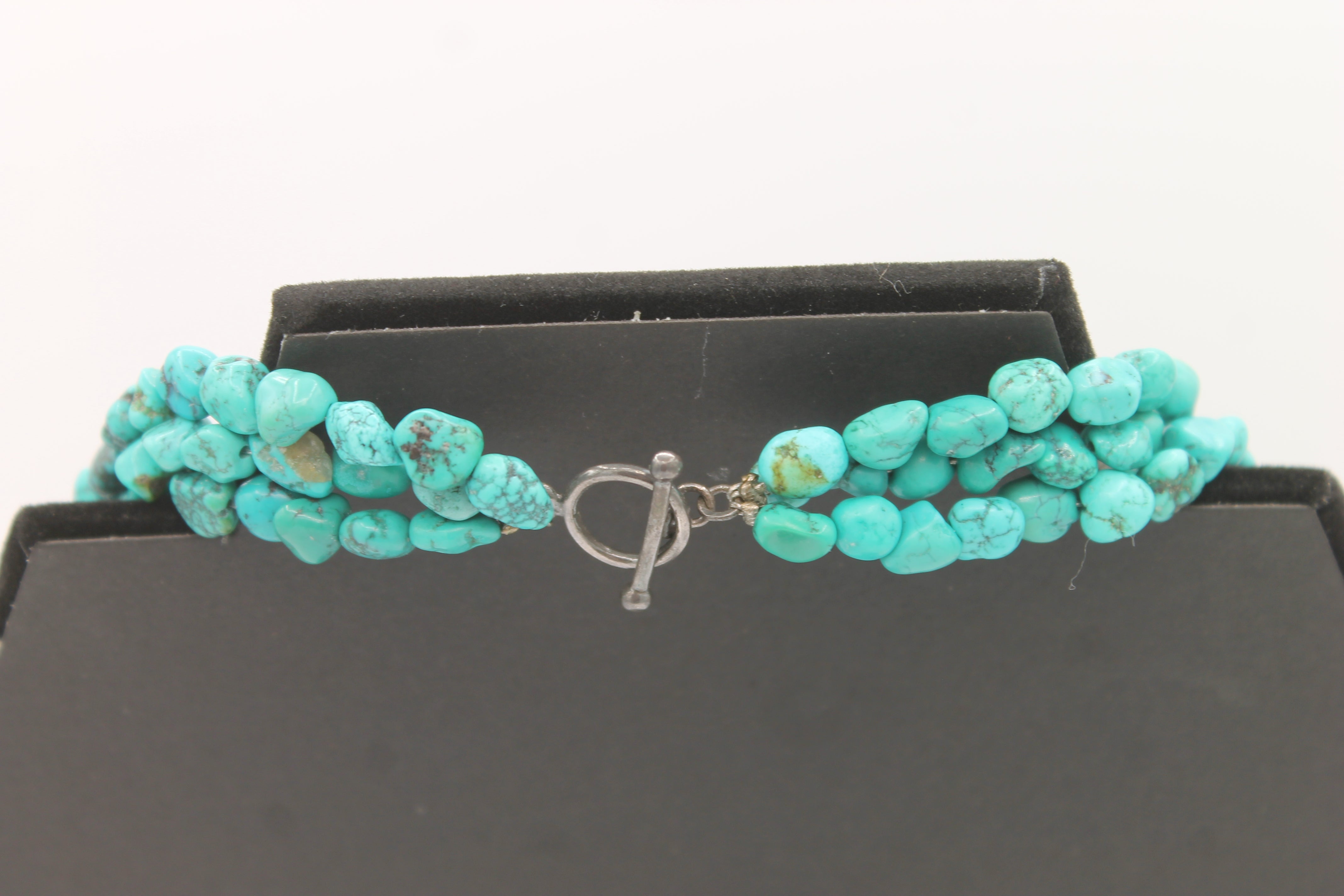 Vintage Navajo Turquoise Nugget Triple Strand Necklace with a Sterling Silver Toggle Clasp.