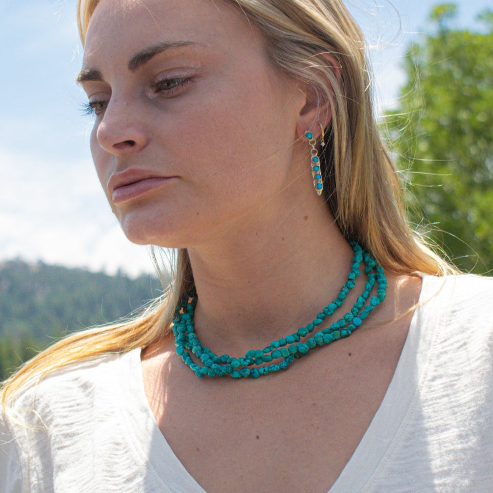 Vintage Navajo Turquoise Nugget Triple Strand Necklace with a Sterling Silver Toggle Clasp.