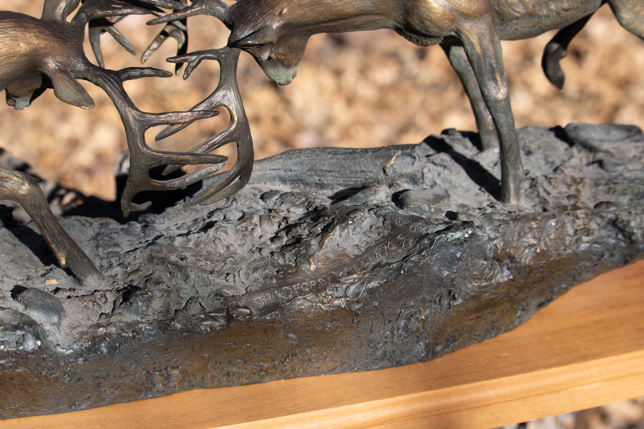 "Dominance II" By  Bradford Williams 85/ 1950.  Bronze sculpture depicts two fighting whitetail bucks