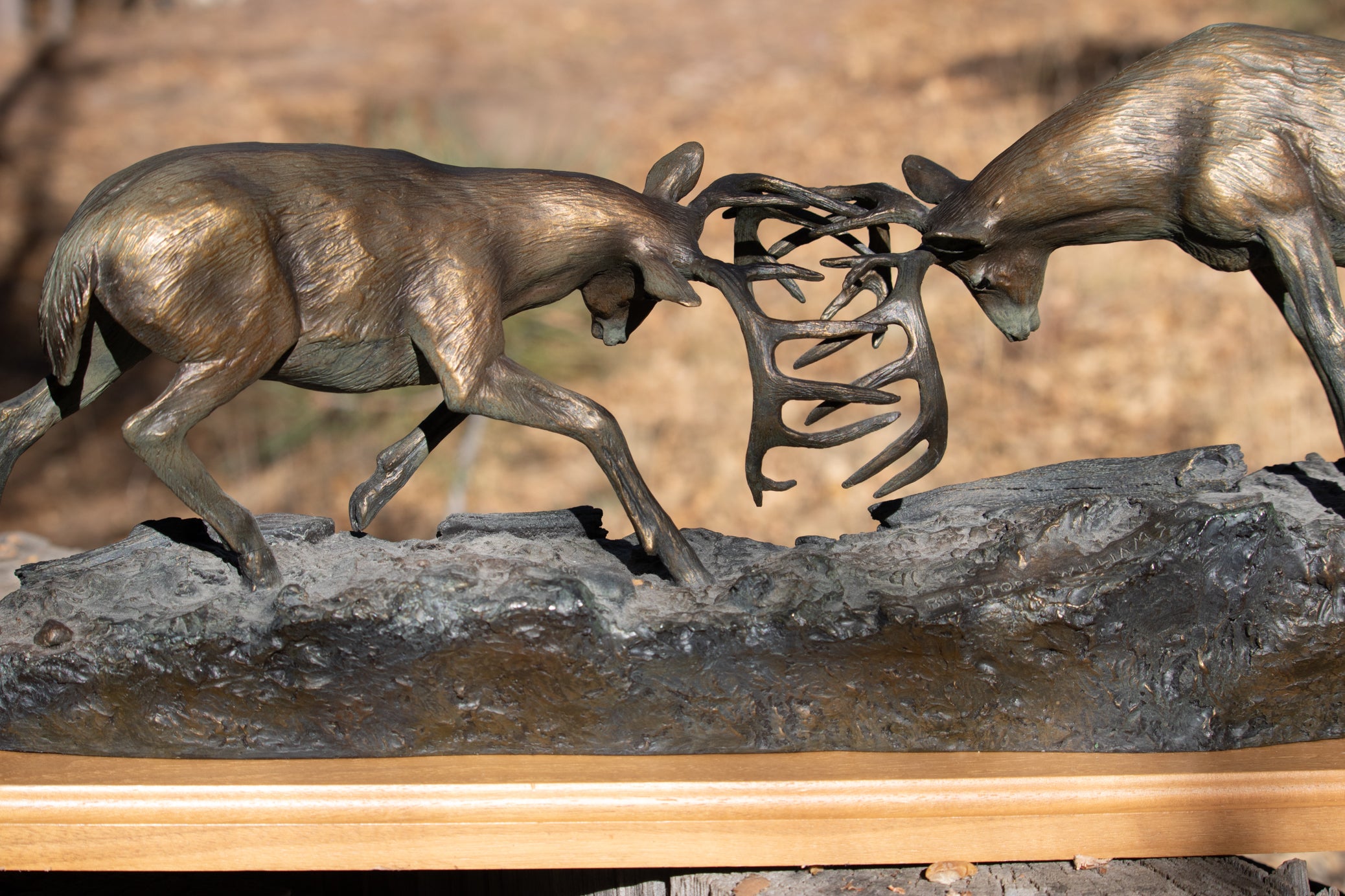 "Dominance II" By  Bradford Williams 85/ 1950.  Bronze sculpture depicts two fighting whitetail bucks